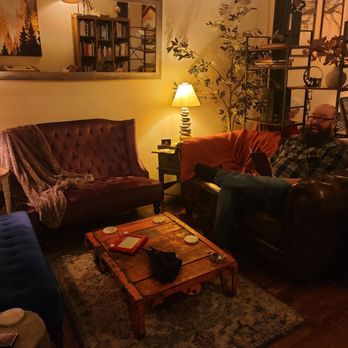 Stages At One Washington - a man sitting in a living room - New American Near Me - Dover, New Hampshire