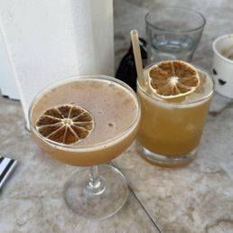 Left: Ocelotl -- Tequila, Xila, passionfruit, lime Right: Gold Rush -- Bourbon, lemon, honey Left: Ocelotl -- Tequila, Xila, passionfruit, lime Right: Gold Rush -- Bourbon, lemon, honey