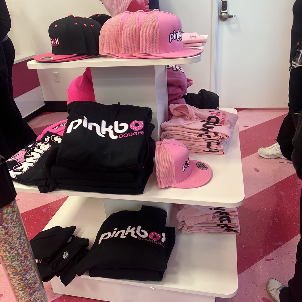 Pinkbox Doughnuts - Little section to purchase sweatshirts, hats and T-shirts right by the line as you come inside. - Donuts Near Me - Las Vegas, Nevada Pinkbox Doughnuts - Little section to purchase sweatshirts, hats and T-shirts right by the line as you come inside. - Donuts Near Me - Las Vegas, Nevada
