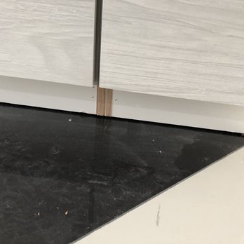Precision Clean East Bay - Damage baseboard from getting it wet and wax residue from improperly sealing porcelain tile cloudy haze on tile - Carpet Cleaning Near Me Precision Clean East Bay - Damage baseboard from getting it wet and wax residue from improperly sealing porcelain tile cloudy haze on tile - Carpet Cleaning Near Me