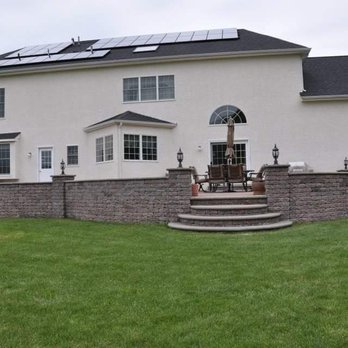Ice Landscaping & General Contractors - a house with solar panels on the roof - Landscaping Near Me - New Castle, Delaware Ice Landscaping & General Contractors - a house with solar panels on the roof - Landscaping Near Me - New Castle, Delaware