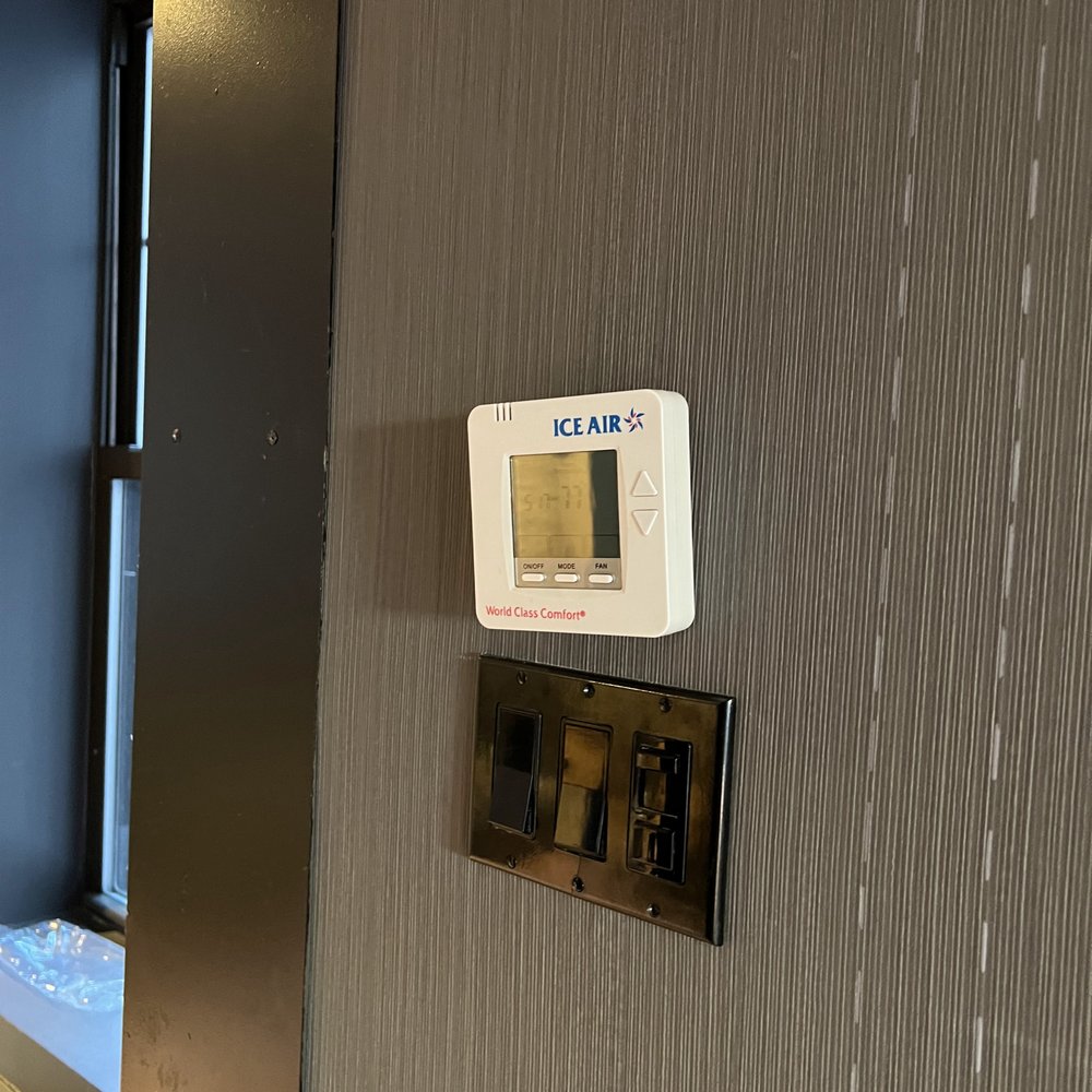 The Time New York - 04/09/2023 Thermostat hanging off the wall - Hotels Near Me - New York, New York The Time New York - 04/09/2023 Thermostat hanging off the wall - Hotels Near Me - New York, New York