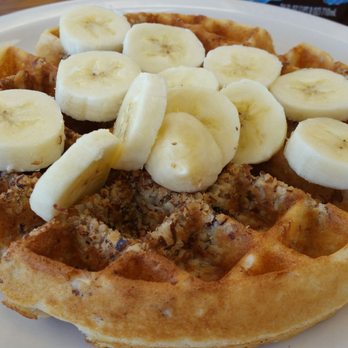 Nana's Kitchen - Belgian waffle with infused pecans top fresh banana slices. The other topping options are blueberries, strawberries. It was very tasty! - Breakfast & Brunch Near Me - Peyton, Colorado Nana's Kitchen - Belgian waffle with infused pecans top fresh banana slices. The other topping options are blueberries, strawberries. It was very tasty! - Breakfast & Brunch Near Me - Peyton, Colorado