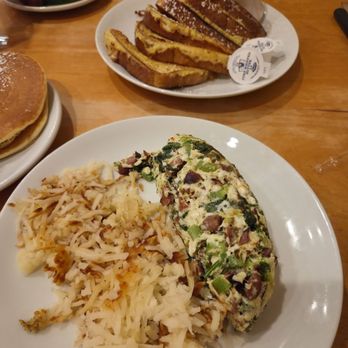 Yolk - South Loop - A Big Green Machine Omelet with Chicken Sausage and an order of French Toast - Breakfast & Brunch Near Me - Chicago, Illinois