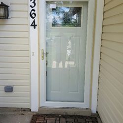 On Point Carpentry & Construction - New front door, storm door, and cedar trim boards painted and installed.