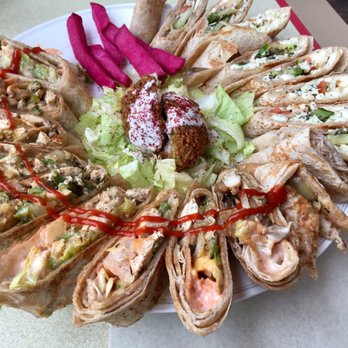 Portuguese Bakery - We ordered 2 sandwiches (Syrian cheese sandwich and chicken sandwich). Beautiful presentation! - Bakeries Near Me - Ottawa, Ontario