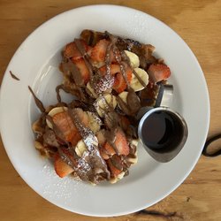 Coffee Journey by Sugar Browning Coffee Roaster - Waffles with banana, strawberries, chocolate sauce, and maple syrup.