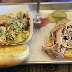 Holy Sm-Oaks Craft BBQ - Pulled pork sandwich with a small side of Brussels slaw