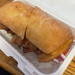 The Fenix: crispy pork belly, lettuce, tomato, onions, cheddar, chipotle mayo, ciabatta bread. The Fenix: crispy pork belly, lettuce, tomato, onions, cheddar, chipotle mayo, ciabatta bread.