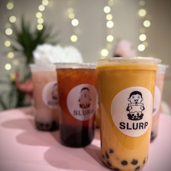 Slurp - three cups of bubble tea on a table - Bubble Tea Near Me - Provo, Utah