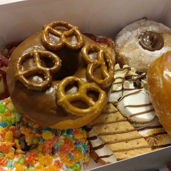 Frosted Donuts - Maple bacon, Nutella filled, classic glazed yeast, s'mores, chocolate pretzel, and Fruity Pebbles donuts. - Donuts Near Me - Tinley Park, Illinois