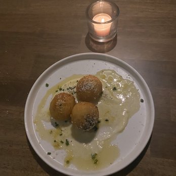 OLIVIA - ARANCINI was over the top delicious.  4 Cheesy risotto balls for  very affordable at $6. Took pic after we indulged in one. - Italian Near Me - Tampa, Florida