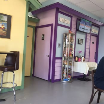 Conch Krawl - a man sitting at a table - Caribbean Near Me - Miramar, Florida