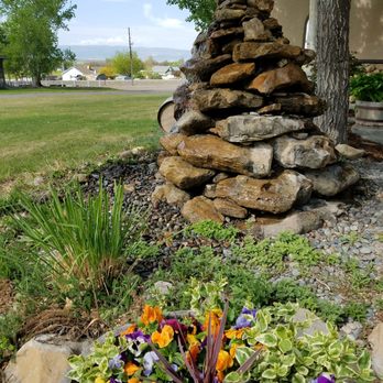 Grande River Vineyards - Pretty water feature and flowers at the entrance! - Wine Tours Near Me - Palisade, Colorado Grande River Vineyards - Pretty water feature and flowers at the entrance! - Wine Tours Near Me - Palisade, Colorado