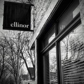 Ellinor - a black and white photo of a storefront - Pizza Near Me - Appleton, Wisconsin