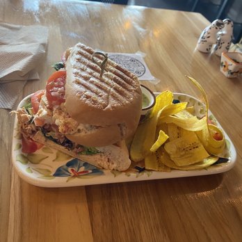 Kolombia Cafe - Garlic Chicken panini with plantain chips and guac sauce. - Cafes Near Me - Orlando, Florida Kolombia Cafe - Garlic Chicken panini with plantain chips and guac sauce. - Cafes Near Me - Orlando, Florida