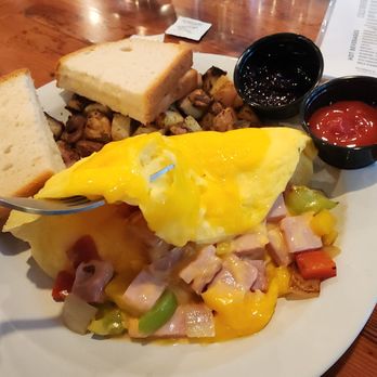 Wanda's Cafe + Bakery - 3-egg omelet with ham, peppers, onions, cheddar, diced potatoes, (option) gluten free Udi's bread and marionberry jam - Bakeries Near Me - Nehalem, Oregon