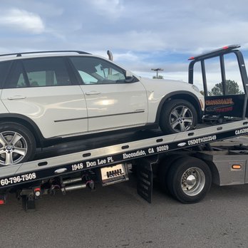 Crossroadz Towing - Diana getting the X5 on the flatbed, 20 minutes after I called for the tow - Towing Near Me - Escondido, California Crossroadz Towing - Diana getting the X5 on the flatbed, 20 minutes after I called for the tow - Towing Near Me - Escondido, California