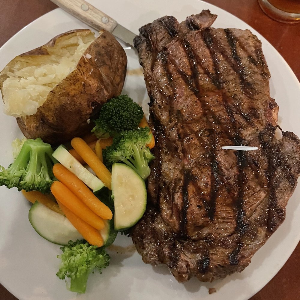The Station - Great Roundhouse Ribeye, Baked potato (Dry) and steamed vegetables - American Near Me - Americus, Georgia The Station - Great Roundhouse Ribeye, Baked potato (Dry) and steamed vegetables - American Near Me - Americus, Georgia