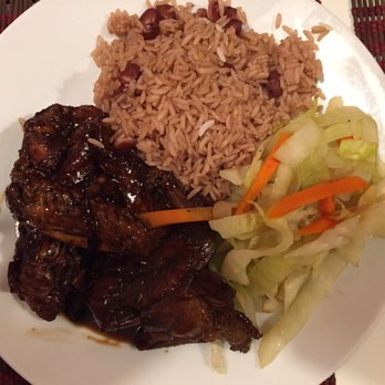 Cafe MoBay - Brown stew chicken with rice and peas and cabbage. - Caribbean Near Me - Bloomfield, New Jersey Cafe MoBay - Brown stew chicken with rice and peas and cabbage. - Caribbean Near Me - Bloomfield, New Jersey