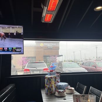 Bubba's 33 - Outside patio table with a warmer over it - Burgers Near Me - Avon, Indiana