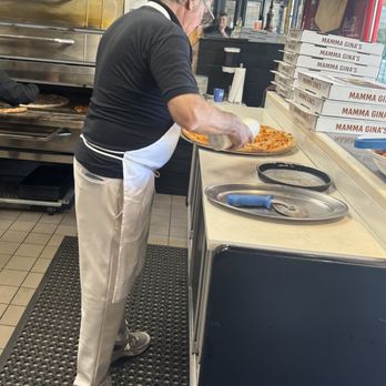 Mamma Ginas Pizza - Making the pizza - Pizza Near Me - Mineola, New York Mamma Ginas Pizza - Making the pizza - Pizza Near Me - Mineola, New York