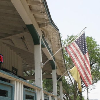 Old Madrid Boarding House - an american flag flying in the breeze - Grocery Near Me - Madrid, New Mexico