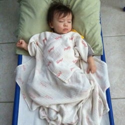 Susan's Daycare - Toddlers take nap in cots like this. Each of them have their own bedding and pillow which gets washed every Friday.
