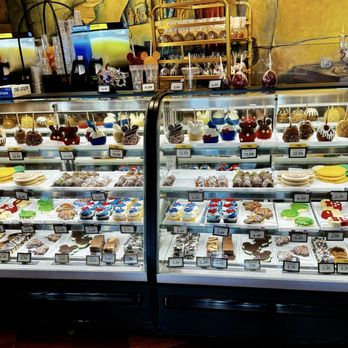 Disney's Candy Cauldron - Display case filled with delicious treats at Candy Cauldron - Desserts Near Me - Lake Buena Vista, Florida Disney's Candy Cauldron - Display case filled with delicious treats at Candy Cauldron - Desserts Near Me - Lake Buena Vista, Florida