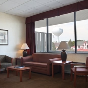 Atlantis Inn - King Suite (Room 324) living room area, balcony overlooking Rehoboth Avenue and water tower - Hotels Near Me - Rehoboth Beach, Delaware Atlantis Inn - King Suite (Room 324) living room area, balcony overlooking Rehoboth Avenue and water tower - Hotels Near Me - Rehoboth Beach, Delaware