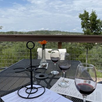 El Gaucho Winery - a table with wine glasses and menus - Wineries Near Me - Spicewood, Texas El Gaucho Winery - a table with wine glasses and menus - Wineries Near Me - Spicewood, Texas
