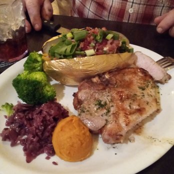 Cody Steak House - Pork chop with fully loaded baked potato and 3 fresh veggies - Steakhouses Near Me - Cody, Wyoming Cody Steak House - Pork chop with fully loaded baked potato and 3 fresh veggies - Steakhouses Near Me - Cody, Wyoming