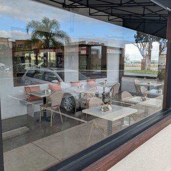 Sunny Side Cafe - Tables and chairs in an enclosed patio. - Breakfast & Brunch Near Me - Seal Beach, California Sunny Side Cafe - Tables and chairs in an enclosed patio. - Breakfast & Brunch Near Me - Seal Beach, California