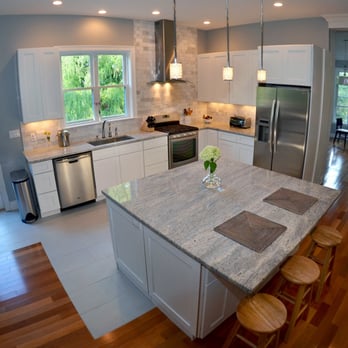 Refine Construction - a kitchen with a center island - General Contractors Near Me - Boston, Massachusetts Refine Construction - a kitchen with a center island - General Contractors Near Me - Boston, Massachusetts