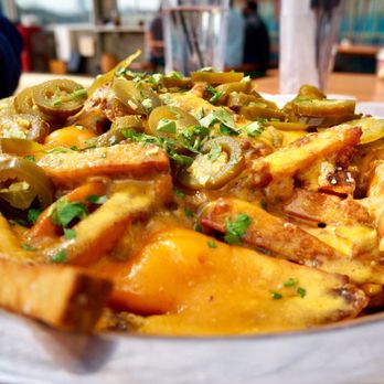 Rodeo Goat - Rodeo Goat's Cheese Fries Surprise fries, Cheddar cheese, Chili, Jalapeños, and Bacon. Comes with side of ranch/spicy ranch ($9.5) - Burgers Near Me - Dallas, Texas Rodeo Goat - Rodeo Goat's Cheese Fries Surprise fries, Cheddar cheese, Chili, Jalapeños, and Bacon. Comes with side of ranch/spicy ranch ($9.5) - Burgers Near Me - Dallas, Texas