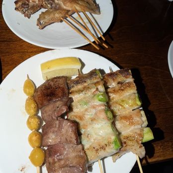 HONDA-YA Tustin - Chicken wings (back). Front (L to R) ginkgo nuts, beef tongue, bacon wrapped asparagus - Sushi Bars Near Me - Tustin, California HONDA-YA Tustin - Chicken wings (back). Front (L to R) ginkgo nuts, beef tongue, bacon wrapped asparagus - Sushi Bars Near Me - Tustin, California