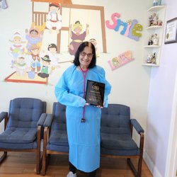 Puri Pediatric Medical Group - Dr. Veena Puri holding a 40 Year service plaque presented to her by Washington Hospital Medical Staff