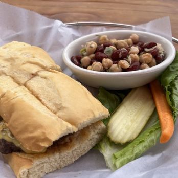 Nepenthe - Ambrosia burger with cheddar and bean salad - New American Near Me - Big Sur, California Nepenthe - Ambrosia burger with cheddar and bean salad - New American Near Me - Big Sur, California