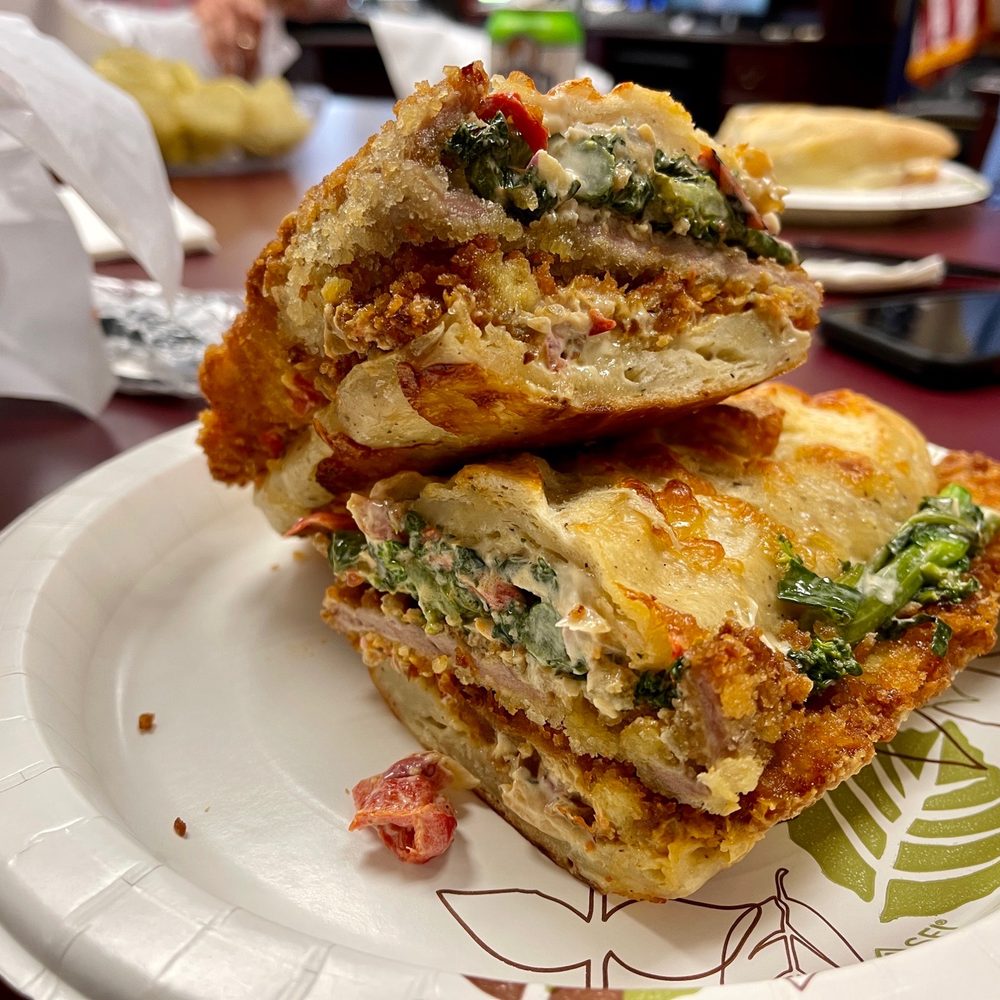 mercato cucina - May 2023 Sandwich Special: crispy pork cutlet, spicy broccoli slaw, Calabrian chili on cheese bread - Coffee & Tea Near Me - Huntington Station, New York