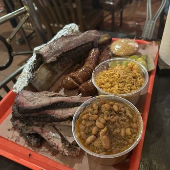 Terry Black's Barbecue - Beef ribs Rice Baked beans Cornbread  Brisket Jalapeño and cheese sausage - Barbeque Near Me - Austin, Texas