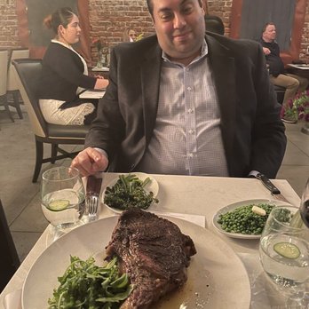 Owen's Bistro - Tomohawk Steak, green peas, brown butter mashed potatoes - New American Near Me - Chino, California