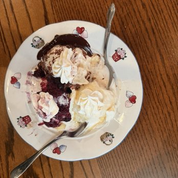The Cornerstone Inn - Banana Split fresh berries and homemade caramel and homemade ice cream. - New American Near Me - Beverly, Ohio The Cornerstone Inn - Banana Split fresh berries and homemade caramel and homemade ice cream. - New American Near Me - Beverly, Ohio