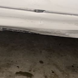 Before the repair see inner door hole and scrapped rocker panel from curb.