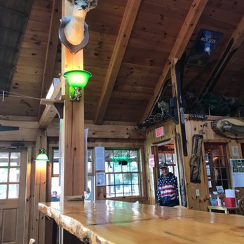 The Mill - a wooden bar with a deer head on it - American Near Me - Old Forge, New York