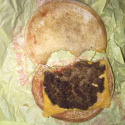 Actual burger with and without flash.Tasted like old cardboard. Drive thru 15min today at 315pm. Teeny ketchup, no mustard, 1 pickle maybe?