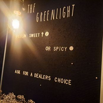 The Green Light - a street sign for the greenlight - Cocktail Bars Near Me - Raleigh, North Carolina