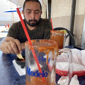 La Sirenita - a man sitting at a table with a drink - Mexican Near Me - Panorama City, California La Sirenita - a man sitting at a table with a drink - Mexican Near Me - Panorama City, California