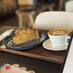 Calioh Coffee - Jalapeño cheddar scone and oatmilk cappuccino