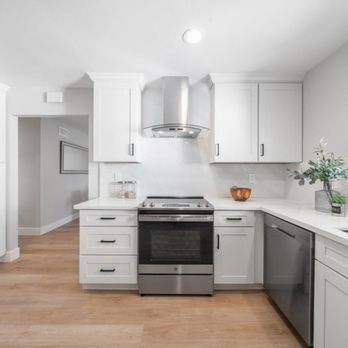 Z Design Construction - a kitchen with white cabinets and stainless steel appliances - General Contractors Near Me - San Jose, California