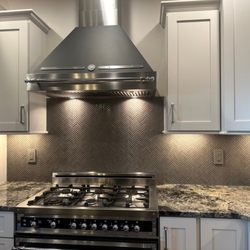 Sapphire Tile - A beautiful custom mosaic tile kitchen backsplash highlights a kitchen remodel.